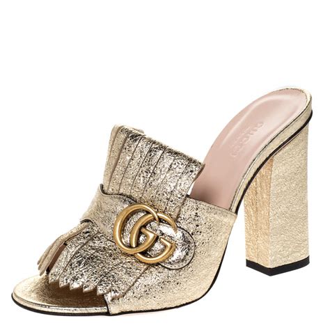 gucci gold fringe mules